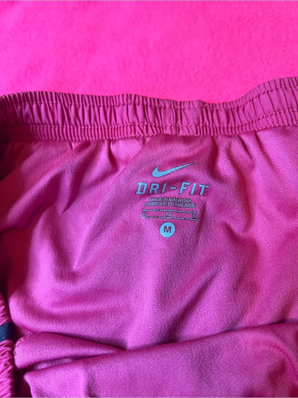 Nike Women's Pink Running Shorts with navy Trim